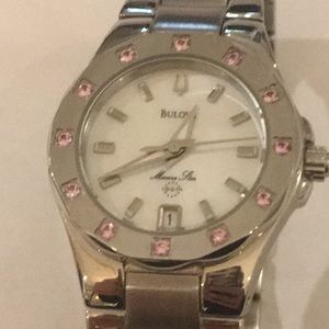 Silver ladies Bulova watch with pink gem stones